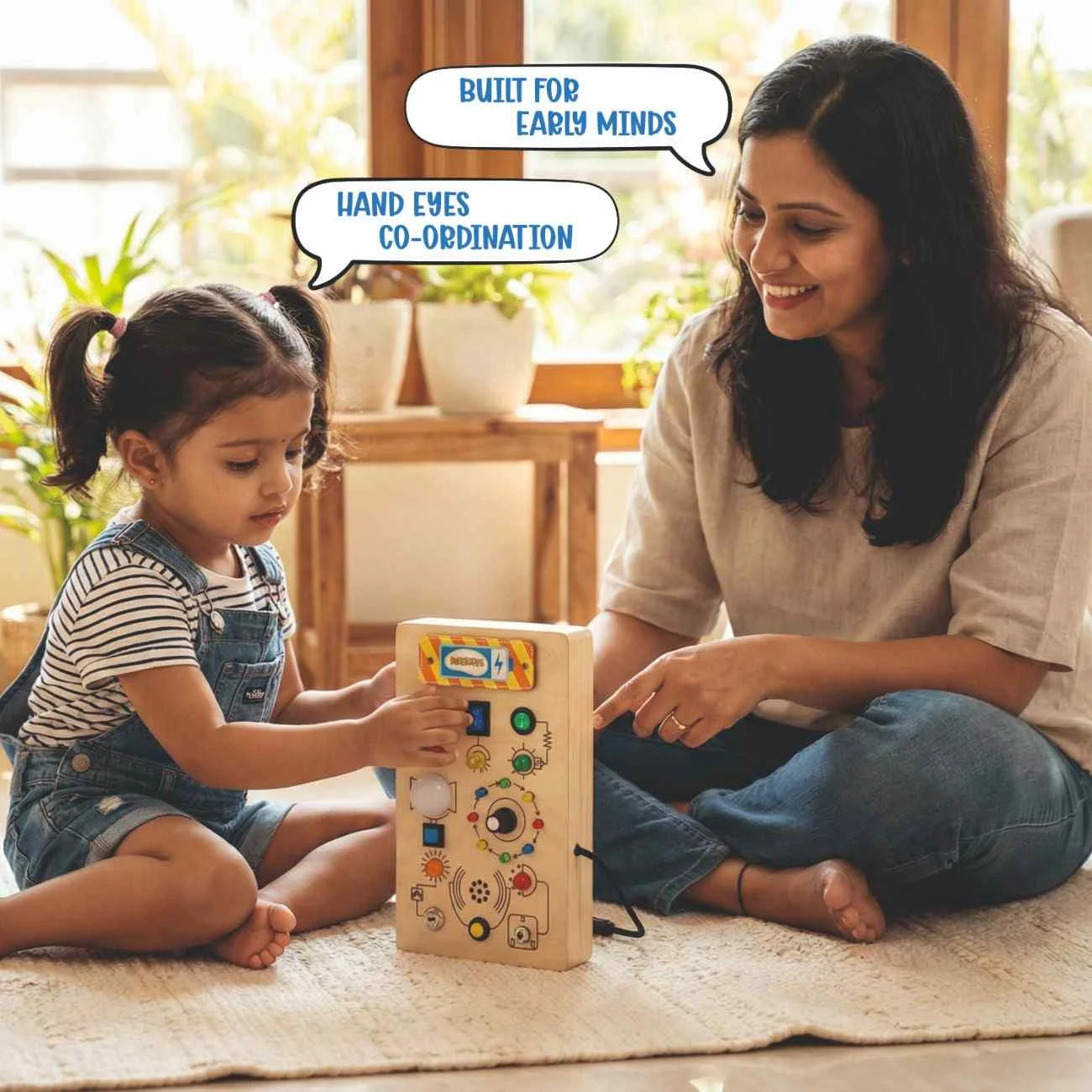 Toddler using Montessori Light Lab activity board with parent