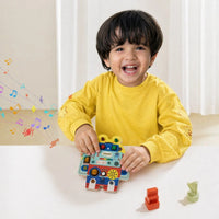child playing pebblepie robot buzz montessori toy